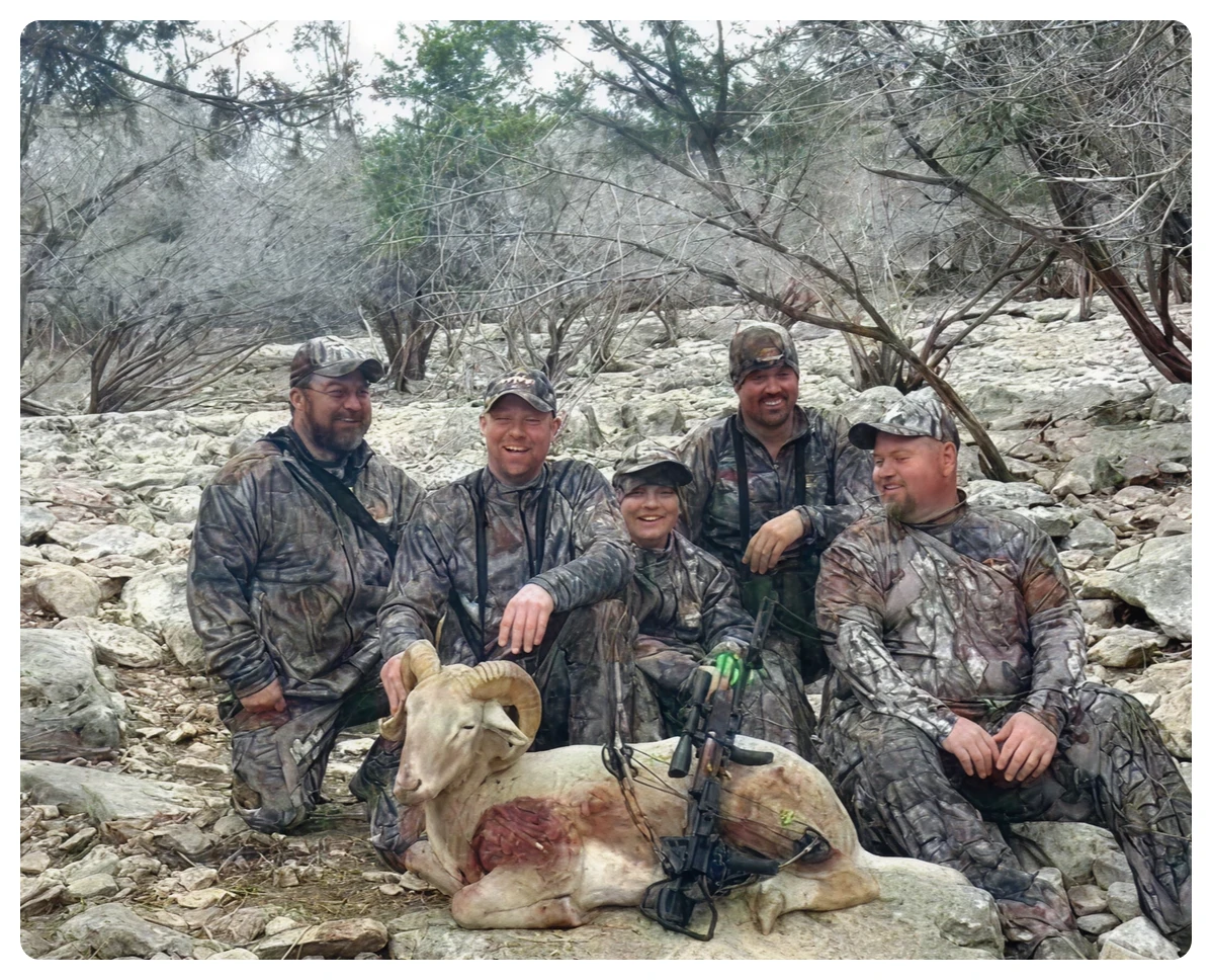 Group in camouflage outdoors with ram