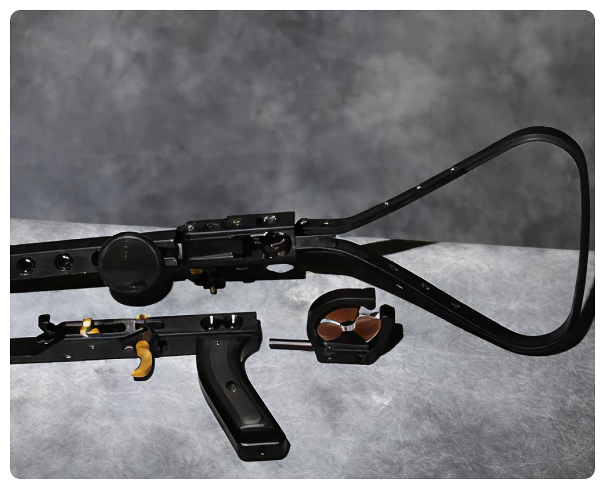 Crossbow parts on a gray surface